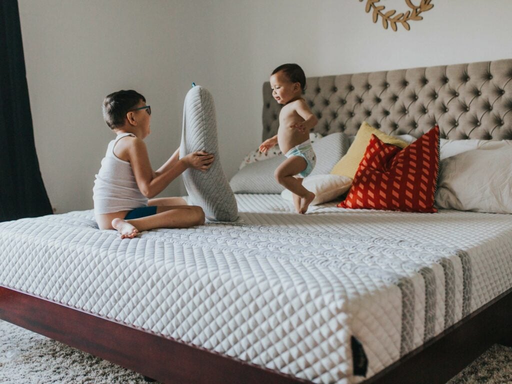 Firm Vs Soft Mattress: - children jumping on bed