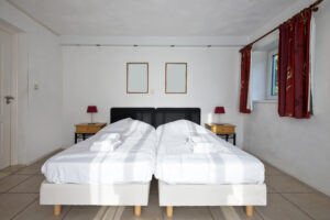 What Is a Split King Bed? - two beds in a room