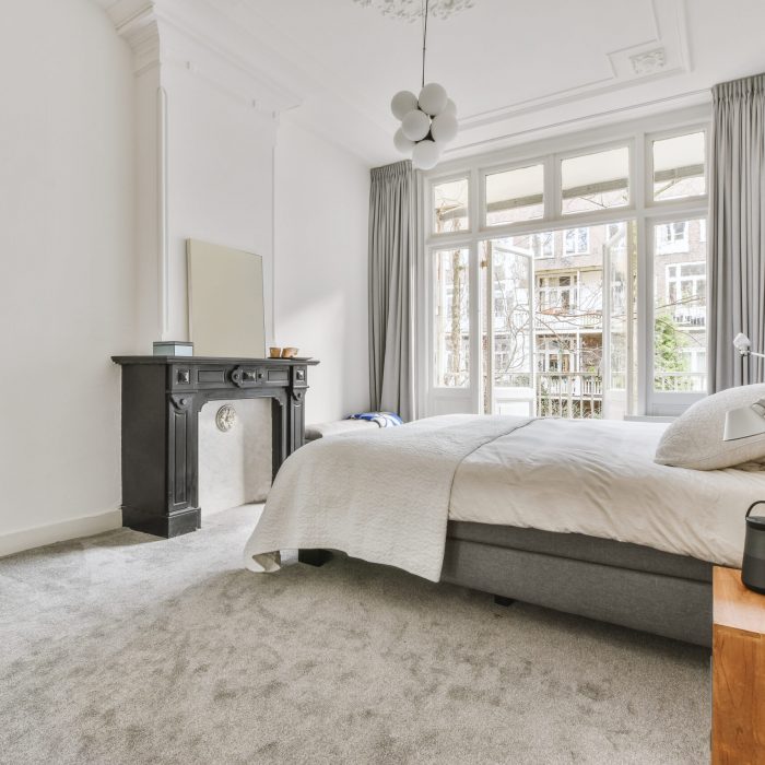 Beds Galore – What Is a Split King Bed? What Is a Split King Bed? - Bed and bedside table near window